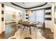 Dining room features a round table with seating, stylish black and white accents, and an open connection to the living room at 924 Forbes Rd, Fort Mill, SC 29707