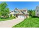 Charming two-story home with stone accents, attached two-car garage, and manicured lawn at 924 Forbes Rd, Fort Mill, SC 29707