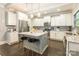 Spacious kitchen with a center island, stainless steel appliances, granite countertops, and modern pendant lighting at 924 Forbes Rd, Fort Mill, SC 29707