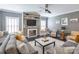 Comfortable living room with fireplace, built-in shelving, and modern decor create an inviting atmosphere at 924 Forbes Rd, Fort Mill, SC 29707