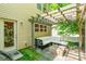Inviting outdoor patio featuring a stylish pergola, comfortable seating, and lush landscaping at 924 Forbes Rd, Fort Mill, SC 29707
