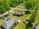 Aerial view of home featuring fenced yard, deck, and manicured lawn at 1005 Spring Rock Dr, Salisbury, NC 28146