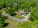An aerial view of a home surrounded by lush greenery and mature trees at 1005 Spring Rock Dr, Salisbury, NC 28146