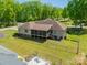 Aerial view of backyard featuring a screened porch, fenced yard, and outdoor seating area at 1005 Spring Rock Dr, Salisbury, NC 28146