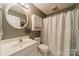 Well-maintained bathroom featuring a tub/shower combination, white cabinets, and neutral decor at 1005 Spring Rock Dr, Salisbury, NC 28146