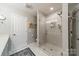 Bathroom boasting a glass shower, toilet, and white hexagonal tile floors at 1005 Spring Rock Dr, Salisbury, NC 28146