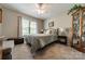 Cozy bedroom with carpet, natural light, and a display cabinet at 1005 Spring Rock Dr, Salisbury, NC 28146