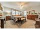 Spacious primary bedroom featuring large windows, soft lighting, and neutral carpeting at 1005 Spring Rock Dr, Salisbury, NC 28146