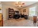 Bedroom with a desk, ceiling fan, carpet, and built-in shelving at 1005 Spring Rock Dr, Salisbury, NC 28146