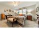 Comfortable primary bedroom featuring a ceiling fan, ample natural light, and neutral decor at 1005 Spring Rock Dr, Salisbury, NC 28146