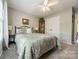 Comfortable bedroom featuring a ceiling fan, carpet, and display cabinet at 1005 Spring Rock Dr, Salisbury, NC 28146