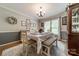 Cozy dining room featuring an updated light fixture, wainscoting, and a large window for natural light at 1005 Spring Rock Dr, Salisbury, NC 28146