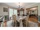 Inviting dining room boasts natural light, a classic hutch, and open access to other living spaces at 1005 Spring Rock Dr, Salisbury, NC 28146