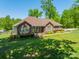Charming brick home with a well-manicured lawn and colorful landscaping at 1005 Spring Rock Dr, Salisbury, NC 28146