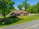 Charming brick home with a well-manicured lawn and mature trees at 1005 Spring Rock Dr, Salisbury, NC 28146