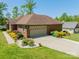 Lovely brick home with an attached garage and landscaped front yard at 1005 Spring Rock Dr, Salisbury, NC 28146