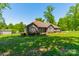 Beautiful home with a brick facade, well-maintained lawn, and mature trees at 1005 Spring Rock Dr, Salisbury, NC 28146