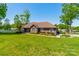 Charming brick home with a lush green lawn and colorful landscaping at 1005 Spring Rock Dr, Salisbury, NC 28146