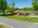 Brick home with lush landscaping, healthy green lawn, and two car garage at 1005 Spring Rock Dr, Salisbury, NC 28146