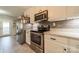 Updated kitchen includes stainless steel appliances, subway tile backsplash, and marble countertops at 1005 Spring Rock Dr, Salisbury, NC 28146