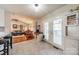 Open kitchen with tile floor, french doors to the back deck and view to living room at 1005 Spring Rock Dr, Salisbury, NC 28146