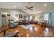 Open living room boasts hardwood floors, vaulted ceiling, and an array of comfortable seating options at 1005 Spring Rock Dr, Salisbury, NC 28146