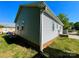View of a single story home with light gray siding and a red brick foundation at 113 Burke Cir, Mooresville, NC 28115