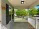 Inviting front porch with white railings, offering a pleasant outdoor space with neighborhood views at 113 Burke Cir, Mooresville, NC 28115