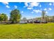 Large backyard showcasing a shed, the house, and ample green space, offering plenty of room for recreation and relaxation at 114 Doubletree Dr, Statesville, NC 28677