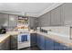 Functional kitchen featuring gray cabinets, white countertops, and modern appliances and lots of storage at 114 Doubletree Dr, Statesville, NC 28677