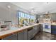 Traditional kitchen with ample counter space, modern appliances, and blue-accented cabinets at 114 Doubletree Dr, Statesville, NC 28677