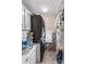 A bright laundry room with tile backsplash, washer/dryer, and decorative elements at 114 Doubletree Dr, Statesville, NC 28677