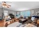Spacious living room with a large sectional sofa, nautical decor, and warm, inviting ambiance at 114 Doubletree Dr, Statesville, NC 28677