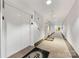 Long interior hallway with multiple white doors, beige carpeting, and elevator access at 127 N Tryon St # 511, Charlotte, NC 28202