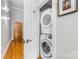 Convenient in-unit laundry closet with stacked washer and dryer at 127 N Tryon St # 511, Charlotte, NC 28202