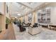 Spacious lobby with high ceilings, ample seating, elegant chandeliers, and unique decorative wall art at 127 N Tryon St # 511, Charlotte, NC 28202