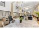 Bright lobby with hardwood floors, decorative carpet, comfortable seating, and natural light from skylights at 127 N Tryon St # 511, Charlotte, NC 28202