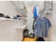 Walk-in closet with ample storage space and well-organized shelves at 127 N Tryon St # 511, Charlotte, NC 28202