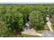 Aerial perspective highlights a tree-lined property with well-maintained lawn and landscaping at 130 Cherokee Ln, Salisbury, NC 28147