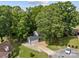 Aerial view showcases this lovely home surrounded by mature trees and lush landscaping at 130 Cherokee Ln, Salisbury, NC 28147