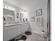 The bathroom features a dual vanity with granite countertops, modern lighting, and a large mirror at 130 Cherokee Ln, Salisbury, NC 28147