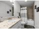 This bathroom has a single sink vanity, tiled floors, and a tub shower at 130 Cherokee Ln, Salisbury, NC 28147