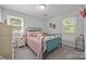 This is a cozy bedroom with natural light and a nightstand beside the bed at 130 Cherokee Ln, Salisbury, NC 28147