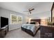 The spacious bedroom includes a ceiling fan, a large window, and carpeted floors at 130 Cherokee Ln, Salisbury, NC 28147