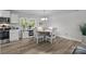 Bright dining room with hardwood floors and a view of the kitchen at 130 Cherokee Ln, Salisbury, NC 28147