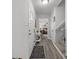Entryway featuring hardwood floors, white trim, front door and entry table with view of living area at 130 Cherokee Ln, Salisbury, NC 28147