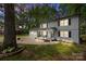 Exterior of charming two-story home with covered front porch, attached garage, and twilight sky at 130 Cherokee Ln, Salisbury, NC 28147
