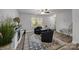Inviting living room with neutral walls, hardwood flooring, a ceiling fan, and natural light at 130 Cherokee Ln, Salisbury, NC 28147
