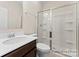 Bathroom featuring a single sink vanity and shower with glass door enclosure at 133 Stonewater Dr # 16P, Red Cross, NC 28129