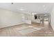 Open living space with hardwood floors, large windows, and abundant natural light at 133 Stonewater Dr # 16P, Red Cross, NC 28129